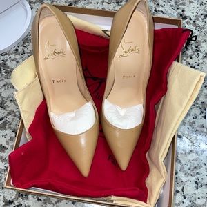 Slightly used Christian Louboutin Size 37 / 7 US.  Heal size 21